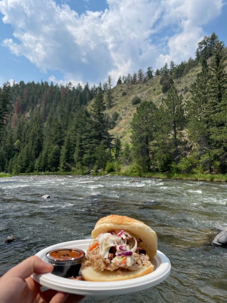 plate full of food at lunch with Clear Creek section behind in Idaho Springs