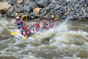 Guests celebrating going through whitewater rapids in Clear Creek - Idaho Springs, Colorado