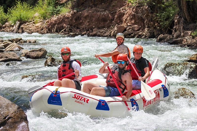 Close up of guests and guide rafting san miguel river near telluride, colorado