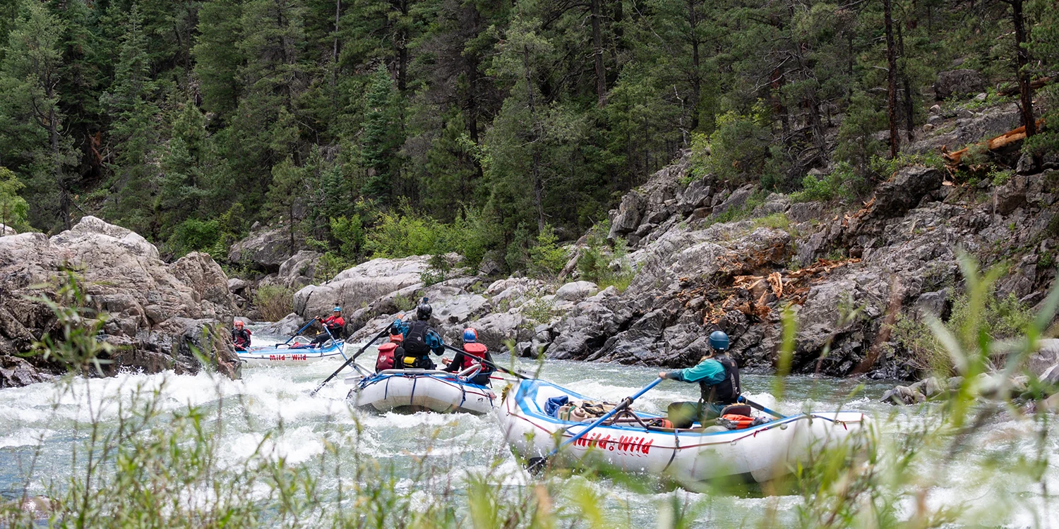 wide shot of rafts paddling down the arkansas river-Numbers Section