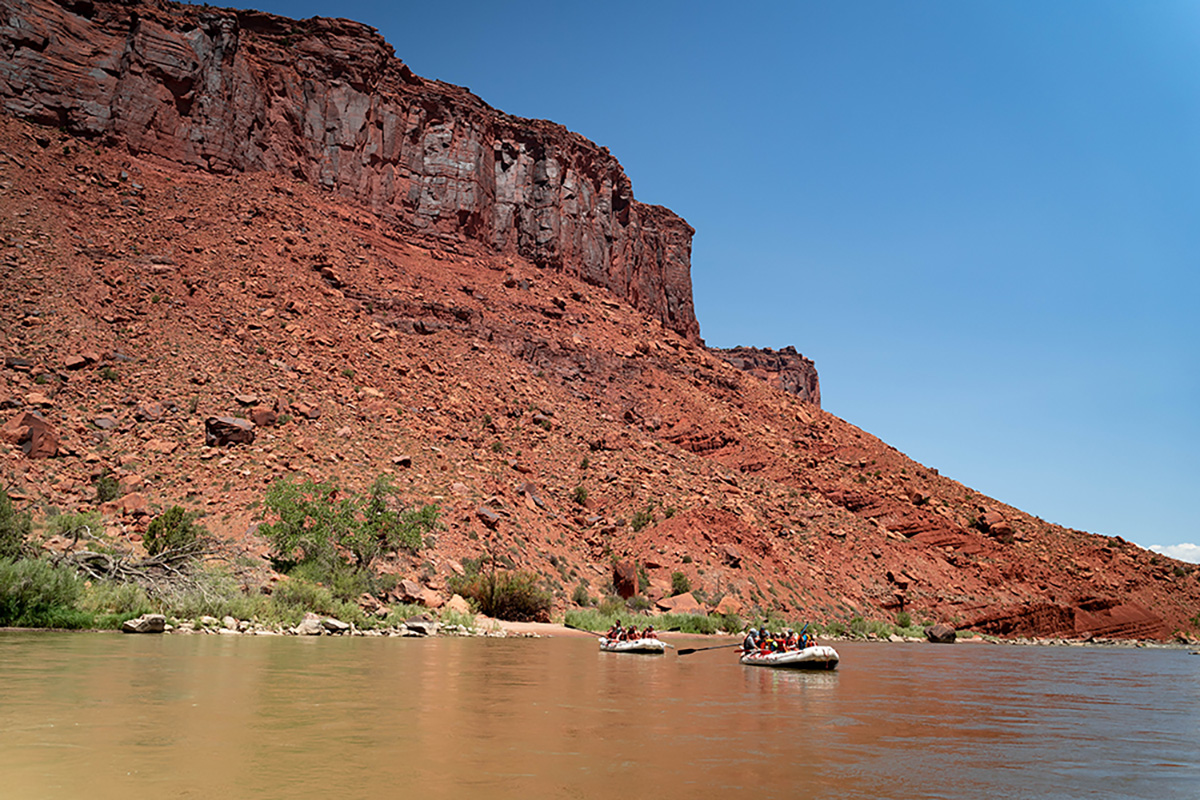 Wide shot of Castle Valley - Red rocks - kayaks - Mild to Wild
