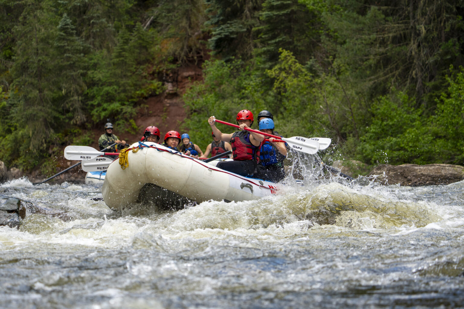 Paddlers going through a rapid on the Upper Piedra River