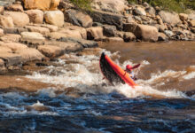 Kayak popping wheelie through Smelter White Water Park - Lower Animas