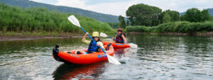 two inflatable kayakers - mom and son on the lower animas - Durango Colorado - Mild to Wild