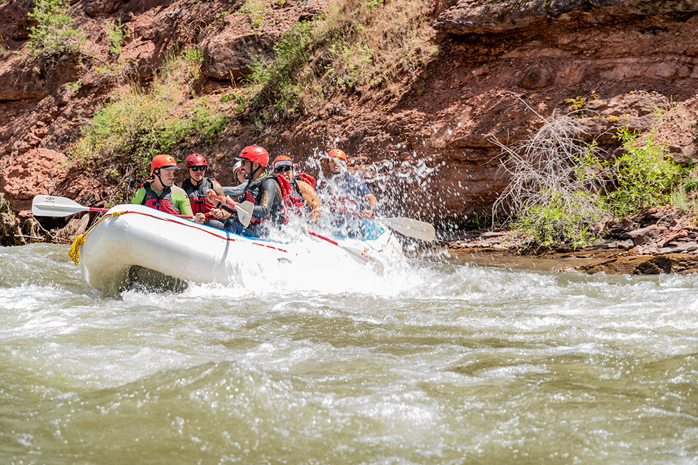 Raft on the San Miguel getting splashed - smiling guests - Telluride Colorado - Mild to Wild