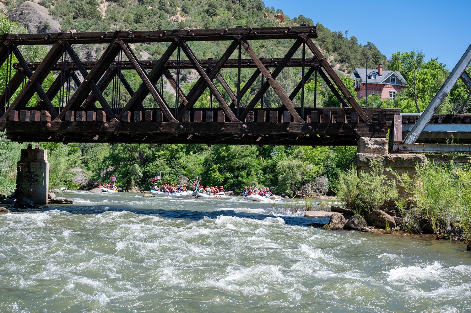 Wide shot of rafts underneath the Train Bridge on the Lower Animas - Durango Colorado - Mild to Wild