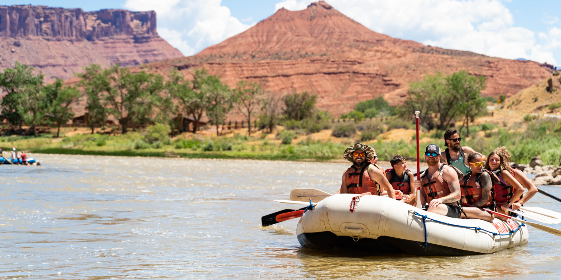 Scenic shot of Castle Valley on the Colorado River with raft in front - Mild to Wild