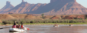 Scenic wide shot of castle Valley with a raft and two kayaks - Red Rock - Mild to Wild