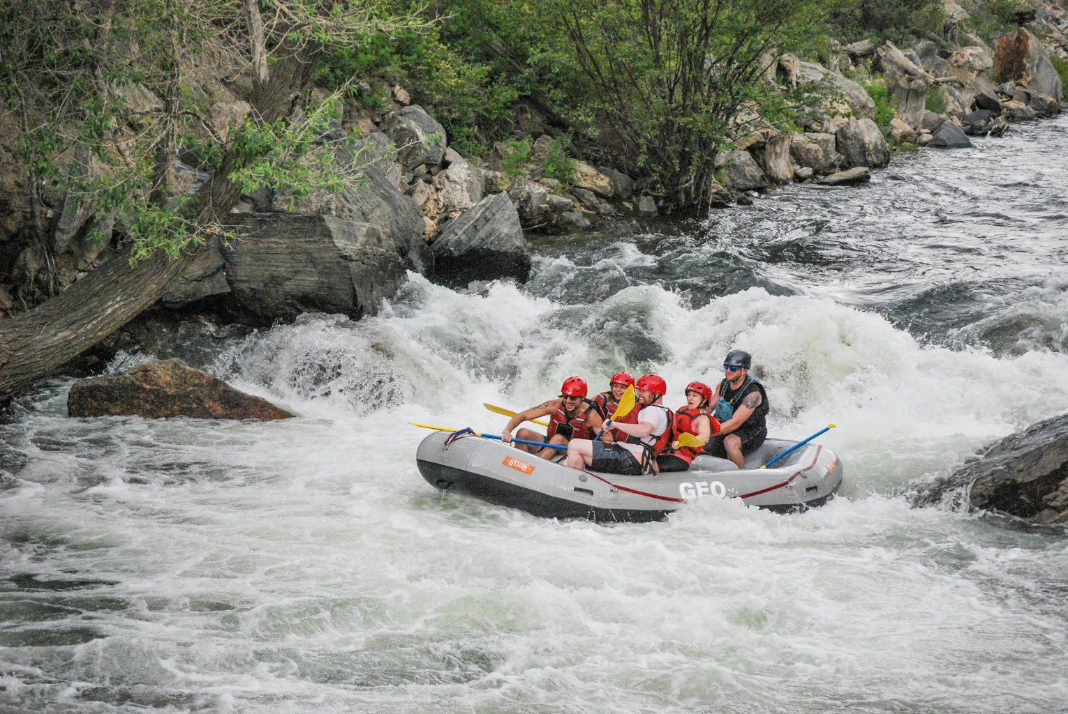 wide shot of whitewater rafting through Clear Creek in Idaho Springs, CO