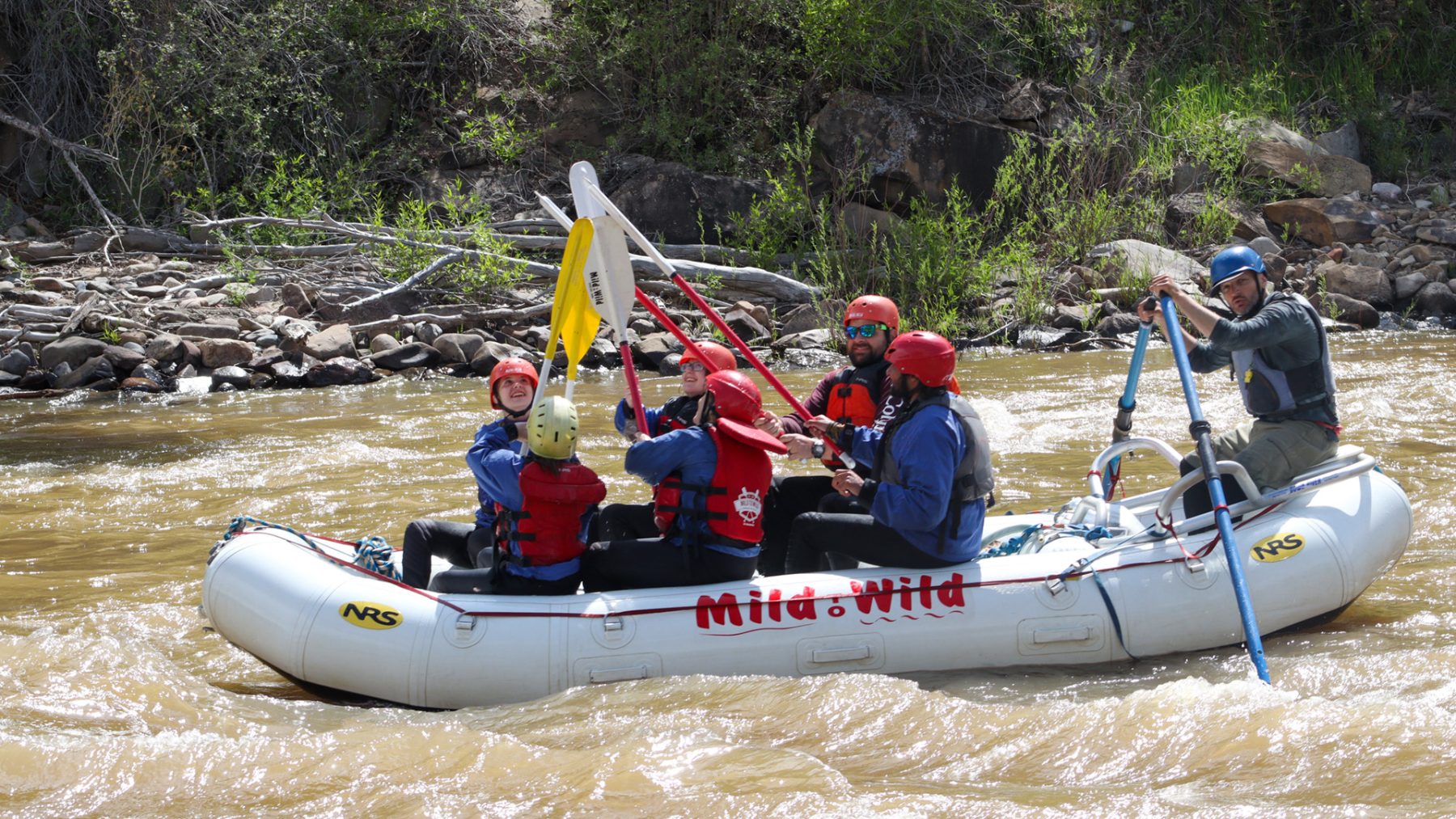 Raft going through animas river in durango colorado - celebrating