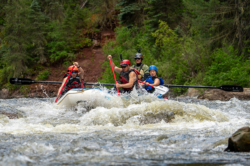 Group rafting through whitewater on the Piedra River - Pagosa Springs Colorado - Mild to WIld
