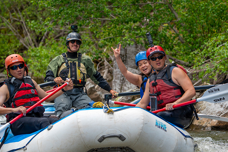 close up of smiling guests on raft on the Piedra River