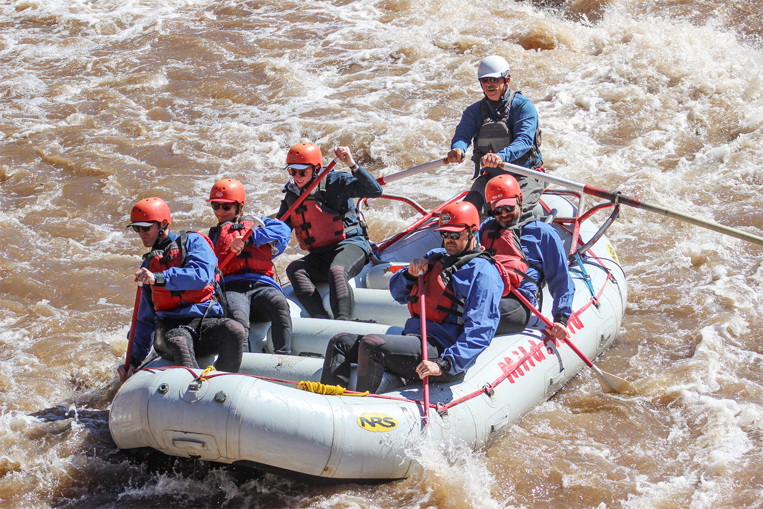 Medium shot of mild to wild raft going through rapids on the Salt River Arizona