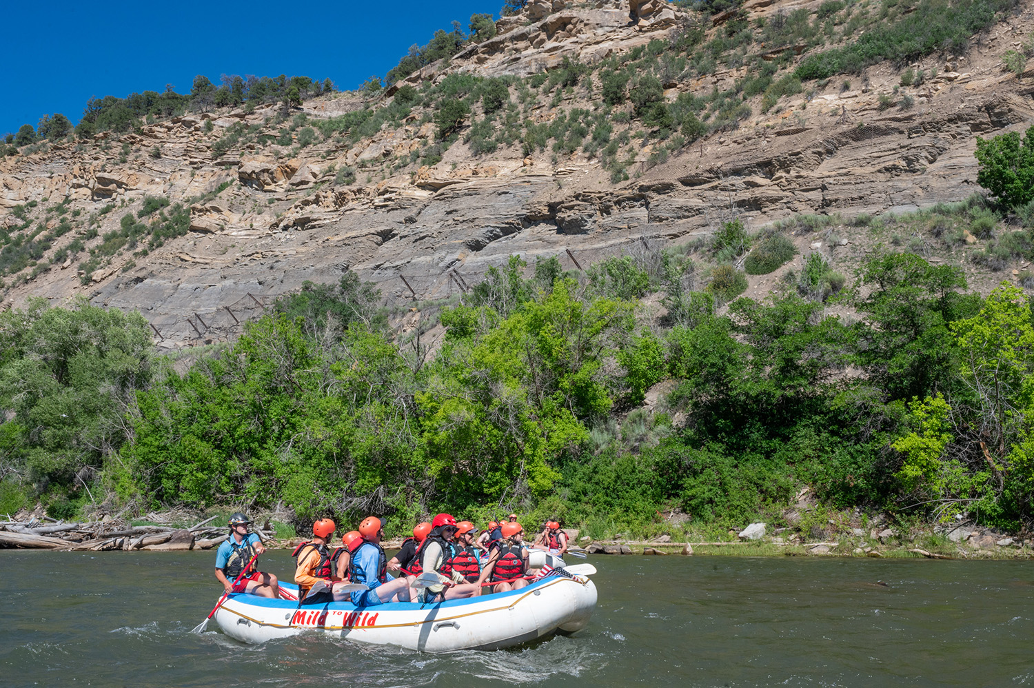 Wide view of the bluffs and lower animas river with raft - Durango, Colorado - Mild to Wild