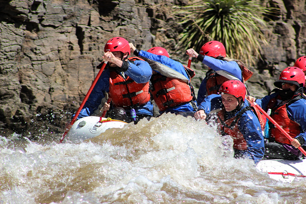 Close up of people paddling in splash jackets on the Salt River - Mild to Wild