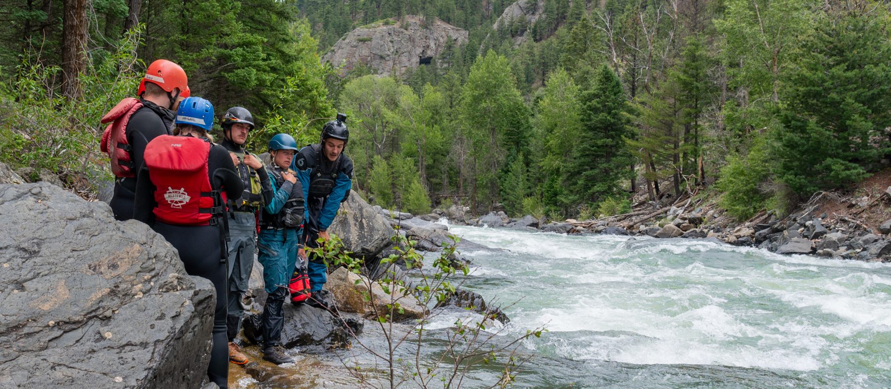 Guides scouting the Upper Animas rapids from shore