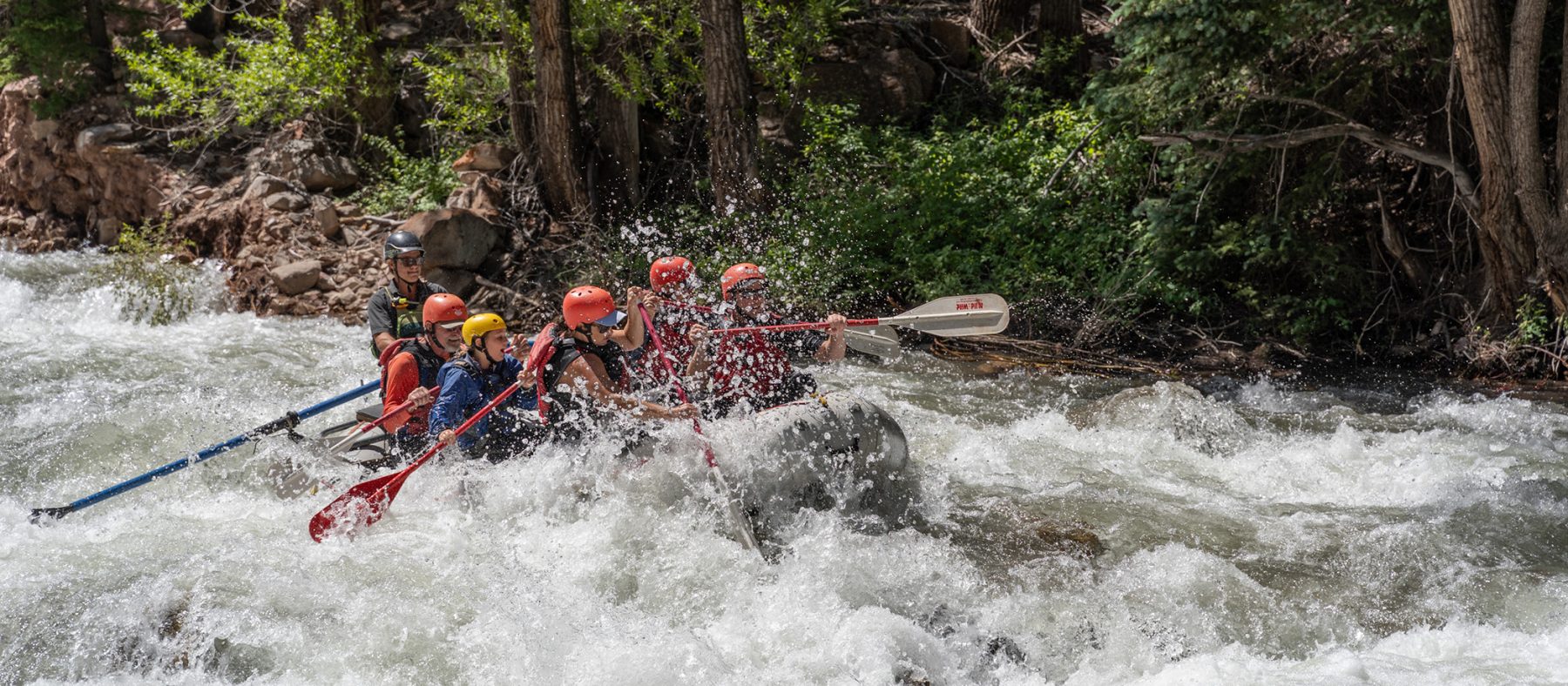 Rafting through sawpit rapid on the san miguel river - big splash - mild to wild