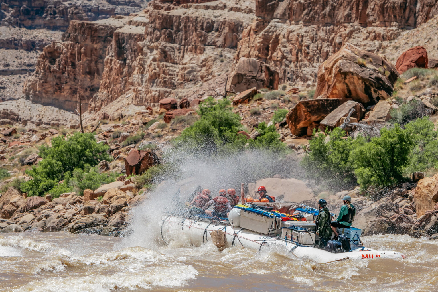 Boat breaking through a huge rapid in Cataract Canyon