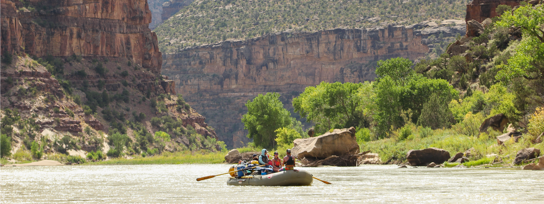 wide shot of Desolation Canyon - Raft in middle of river - Mild to Wild