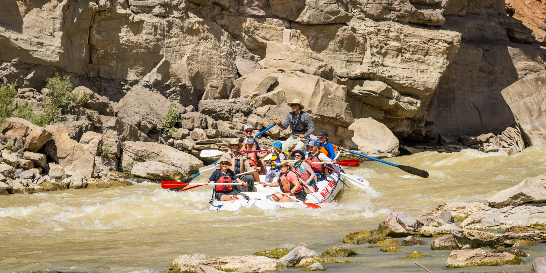 Rafting through rapids in Desolation Canyon - Mild to Wild