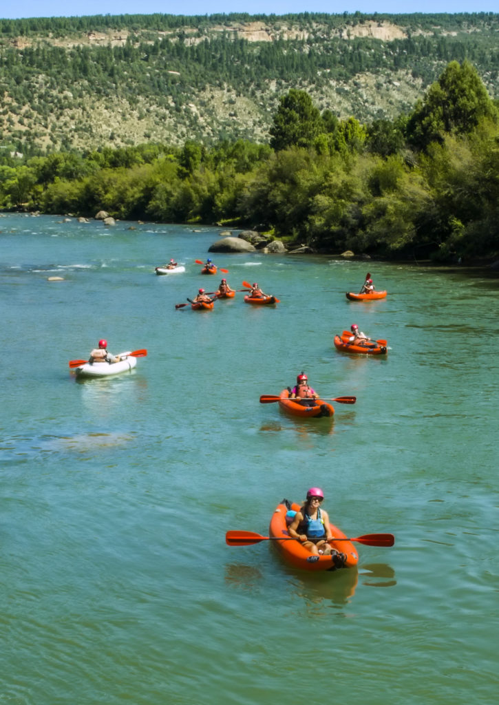 inflatable kayaking on the animas river by the high school bridge in Durango