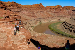 Wide scenic shot of Cataract Canyon with hikers on the trail