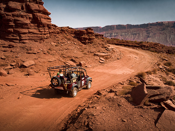 Family jeep tour through red rock in Moab Utah