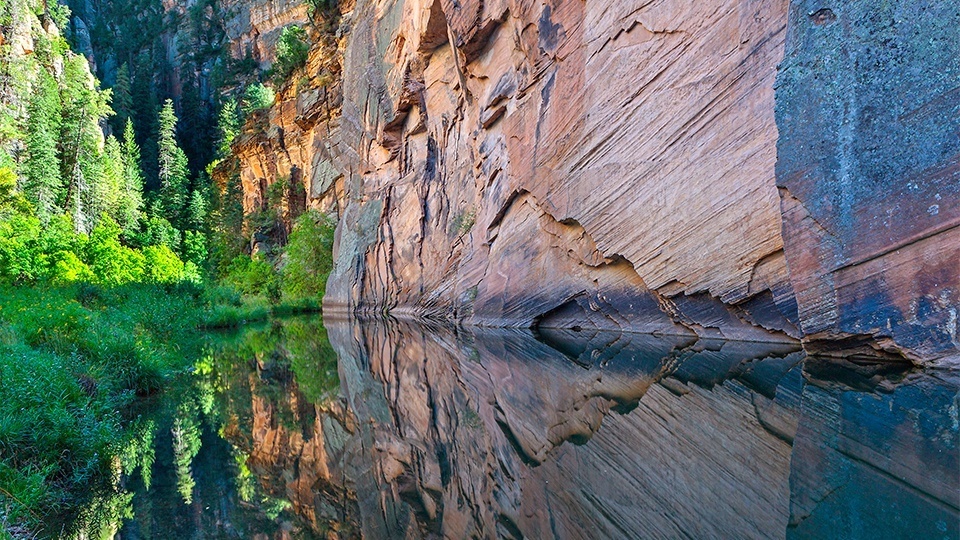 Clear water reflection of West Water Creek trail - Mild to Wild 