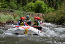 People paddling the San Miguel in inflatable rafts - Mild to Wild