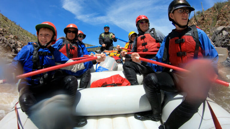 Upper Salt River Canyon - Close-up of a Family rowing through rapids