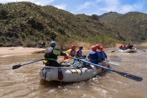 Upper Salt River Canyon - medium shot of boats with beach and desert scenery