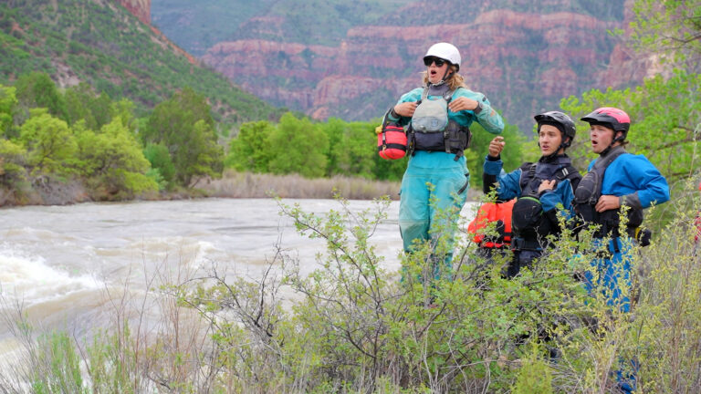 Medium shot of river guides Scouting Snaggletooth on the Dolores River