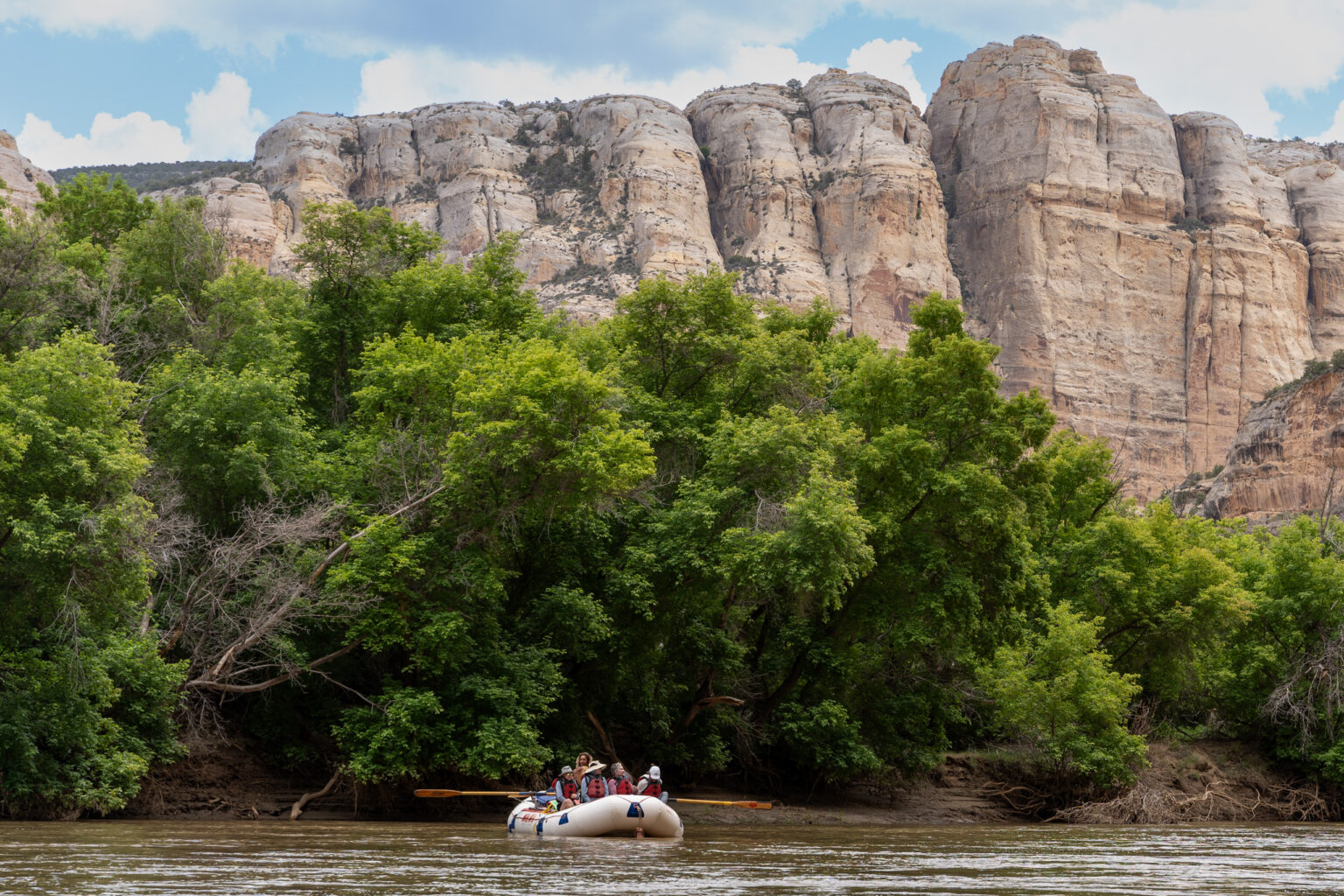 Yampa River - Scenic boat shot with rocks and trees in the background