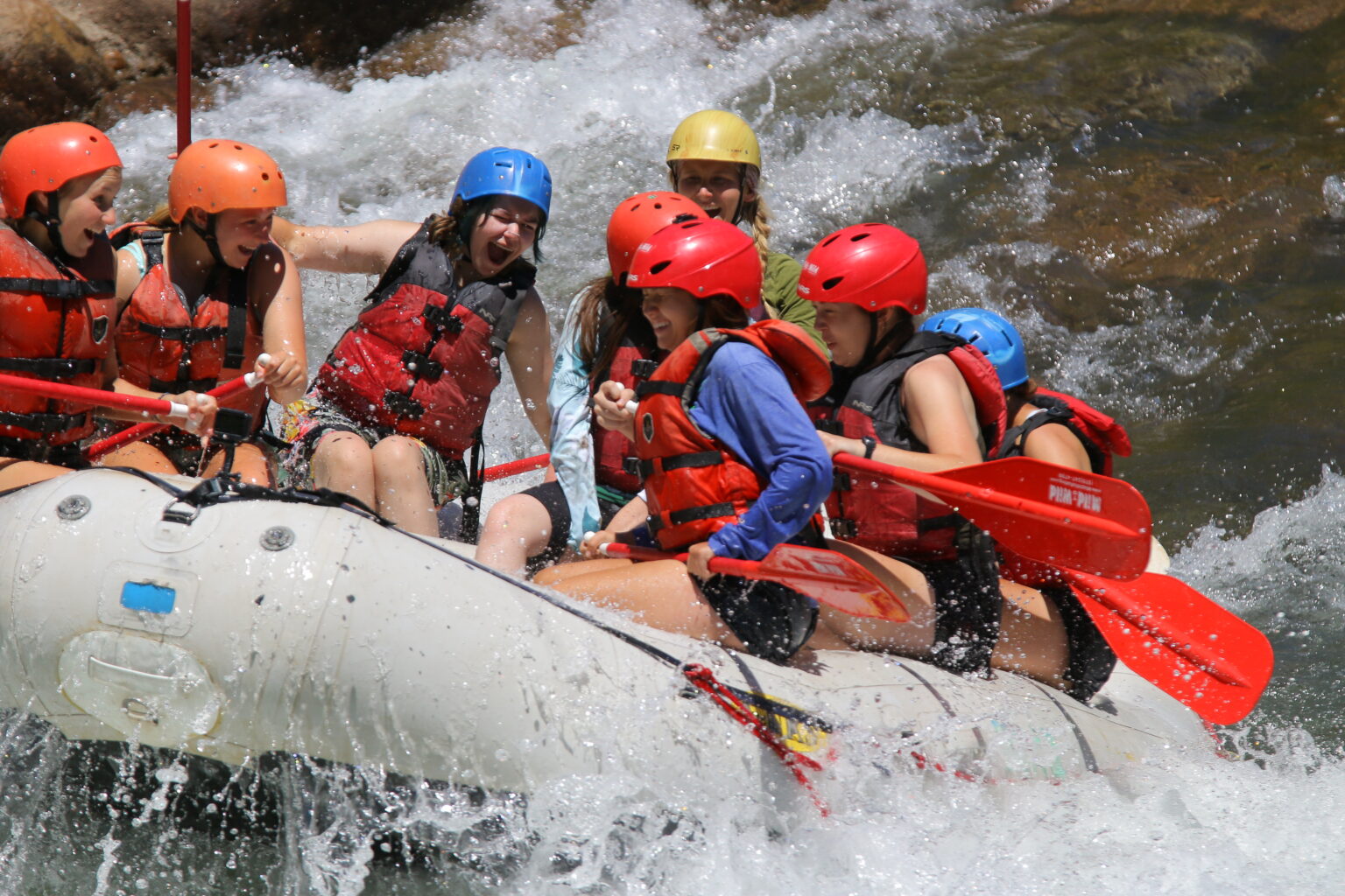 close up of people on raft getting splashed going through Smelter whitewater park on the Lower Animas river - Durango, Colorado - Mild to Wild