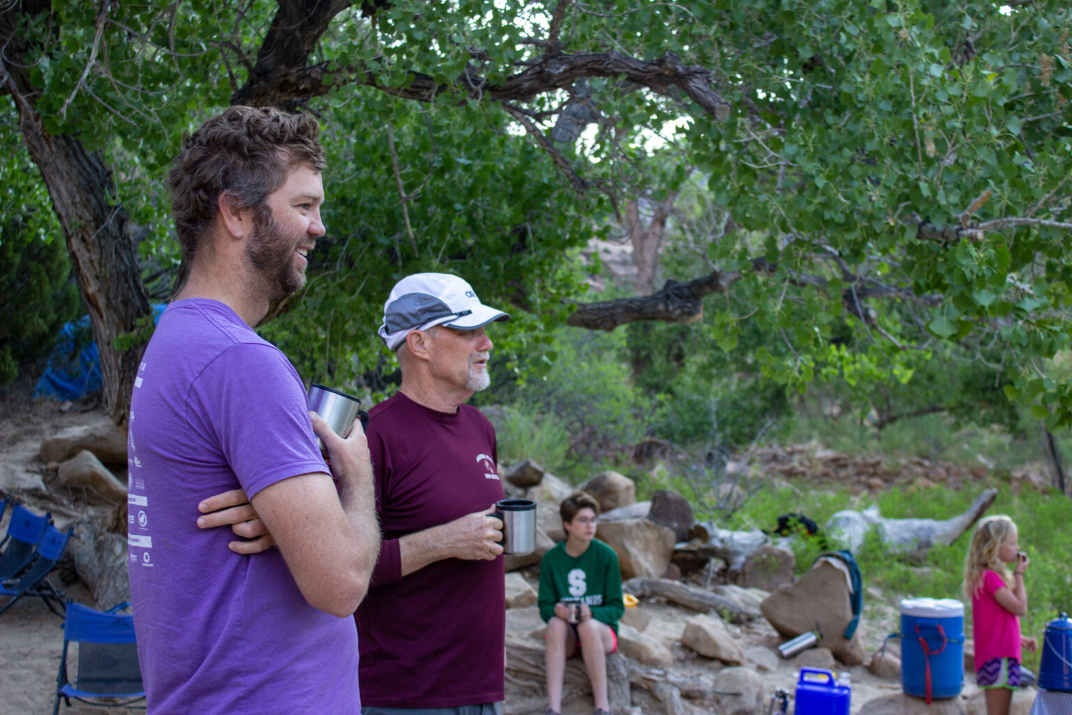 Dads drinking coffee at camp in Desolation Canyon - Mild to Wild