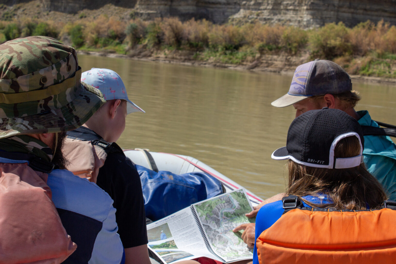 Guide showing Desolation Canyon river map to kids - Mild to Wild