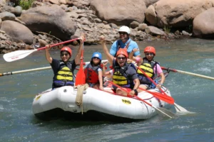 Lower Animas Rafting - Group celebrating in Raft after Smelter Rapid - Mild to Wild