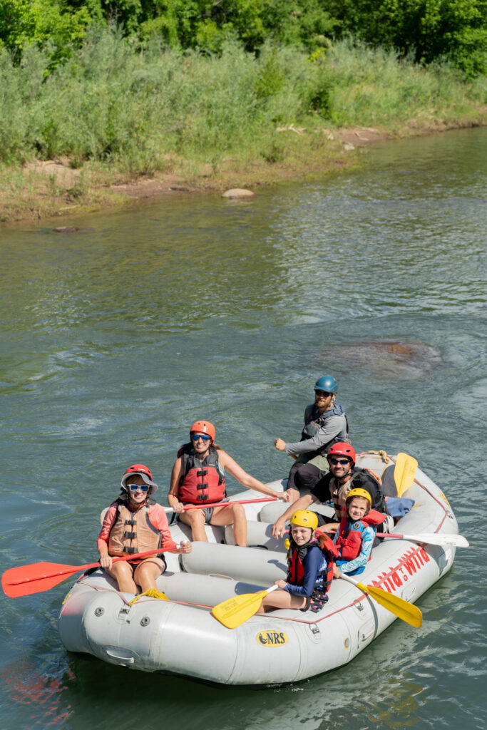 Durango Rafting on the Lower Animas - 29th street - Family smiling on the boat - Mild to Wild