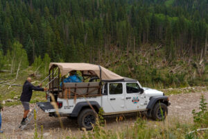 Jeep Gladiator in front of avalanch debris