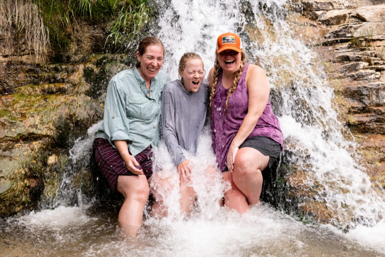 Girls standing under butt Dam Falls getting soaked - Gates of Lodore