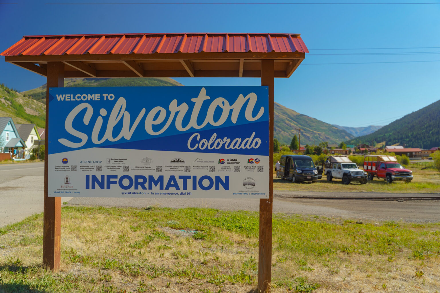 Welcome to Silverton Colorado Sign with Mild to Wild Jeeps in background - Trails and Rails meeting spot