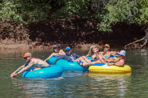 Close up of group of Tubers smiling and laughing on the lower animas river - mild to wild