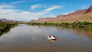 wide shot of castle valley with a raft - colorado river - multi-day rafting trip