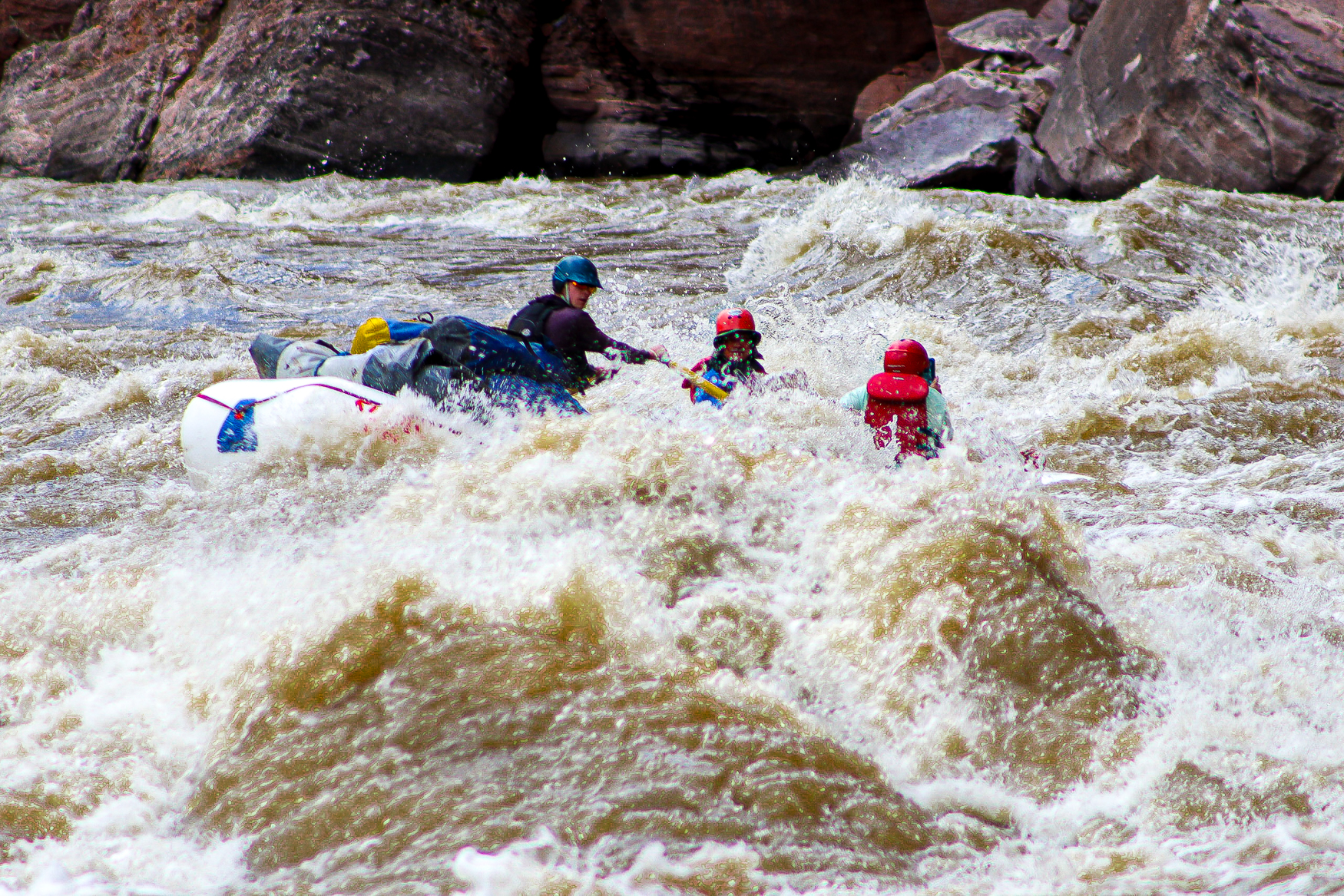 River guide rows through the big waves of Warm Springs Rapid on the Yampa River - Mild to Wild