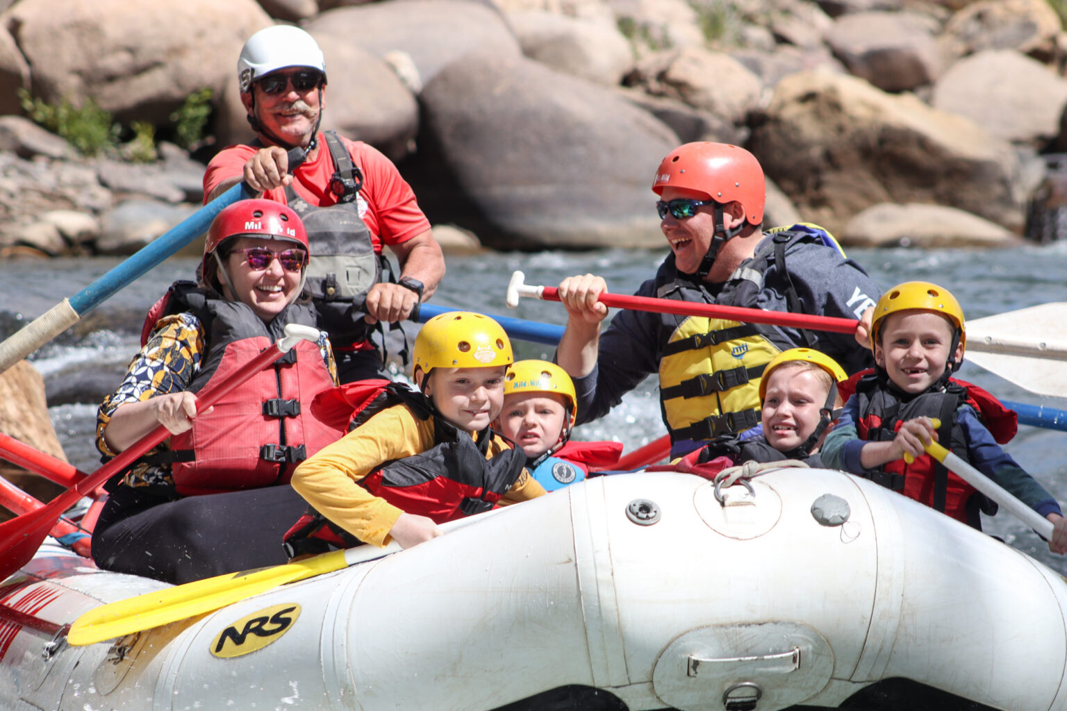 Close up of family rafting through smelter rapids in Durango, Colorado