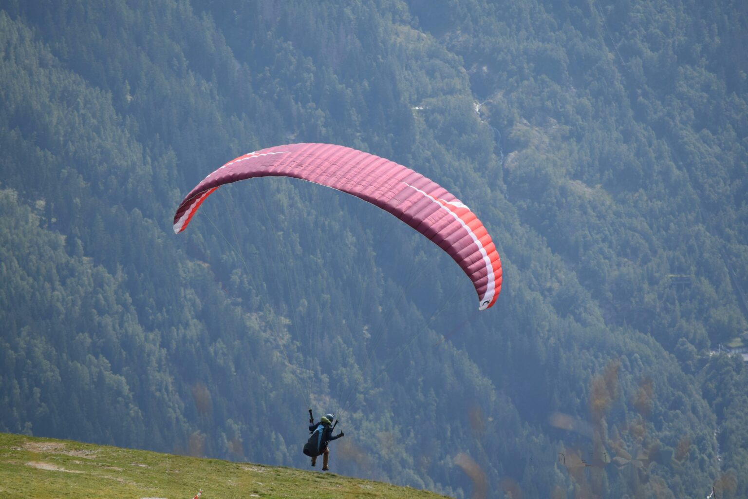 Paraglider taking off into the alpine - Mild to Wild