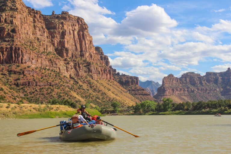 Boat floating down the Green River in Desolation Canyon