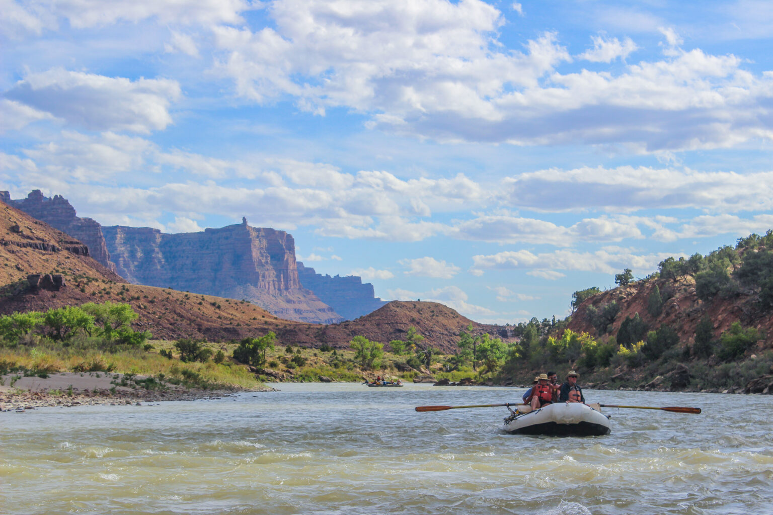 Boat floating down the Green River in Desolation Canyon