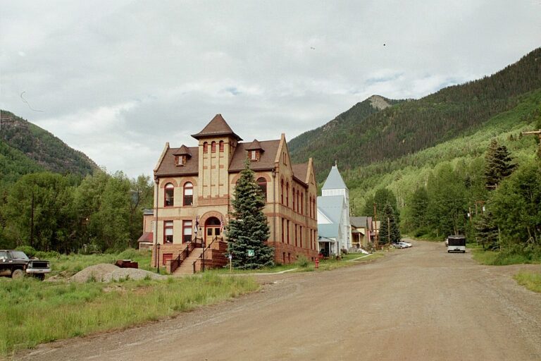 View of the courthouse on a dirt street in Rico, Colorado