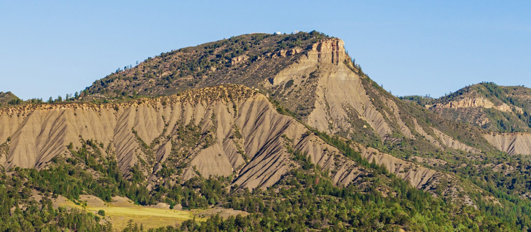 Medium shot of Hogs Back Mountain in Durango Colorado - blue sky